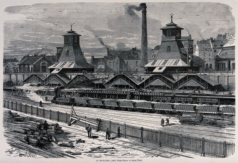 A railway siding with trucks of coal, buildings and a large chimney. Wood engraving after J.Ferat . Wellcome Collection